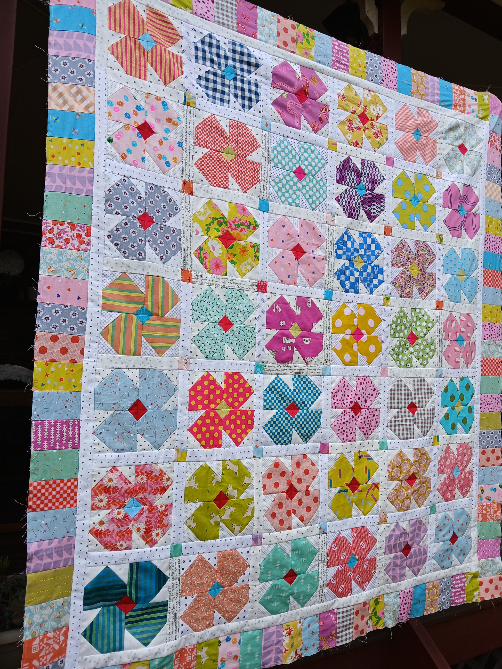 Petal Twist Quilt Colourful flower quilt