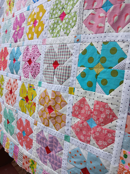 Petal Twist Quilt pattern by Thimbles and Needles