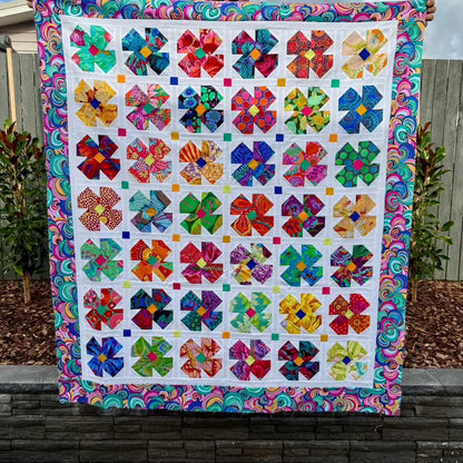 Petal Twist Quilt pattern made in Kaffe Fassett fabrics