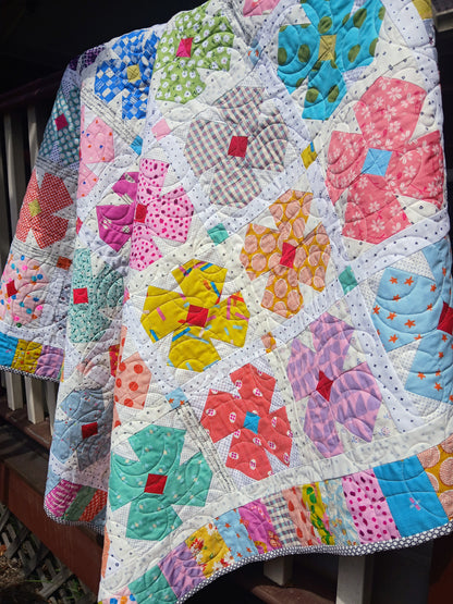 Petal Twist flower quilt pattern by Thimbles and Needles